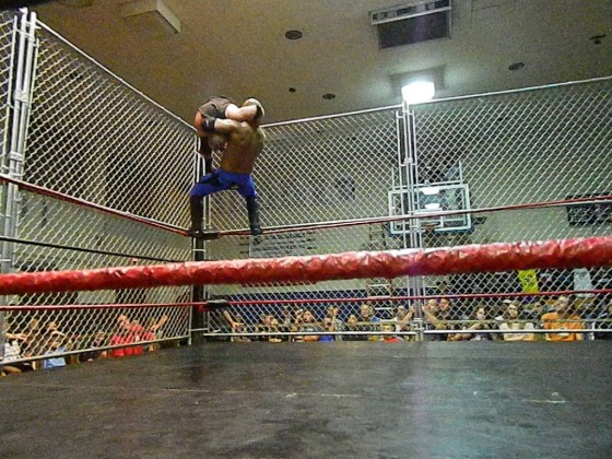Reyes with a superplex on Amazing Red
